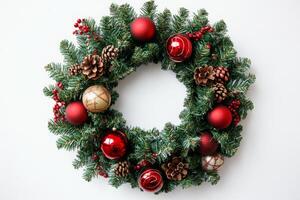 Elegant close-up of a festive Christmas wreath adorned with shiny ornaments and pinecones, perfect for seasonal decor photo