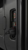 Electric charging port on a commercial vehicle fleet during a busy day at the logistics center photo