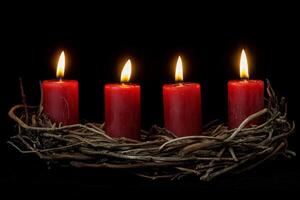 Elegant Advent wreath with four burning red candles, a festive Christmas decoration from France photo