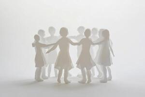 Nine paper silhouettes of children holding hands in a circle, symbolizing unity and friendship in a minimalistic setting photo
