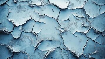 Cracked blue wall with texture and details highlighted in natural light photo