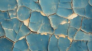 Cracked blue wall texture in a weathered urban setting highlighting layers of history and decay photo