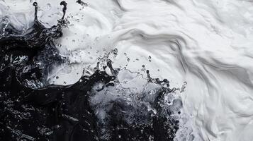Black and white paint swirls, splash, abstract background, texture photo