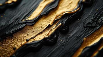 Abstract black gold paint texture, close-up, artistic background, design element photo