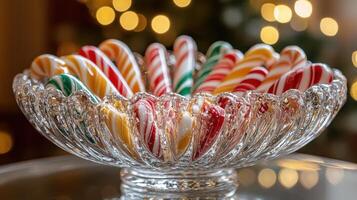 Candy canes in crystal bowl, Christmas lights photo