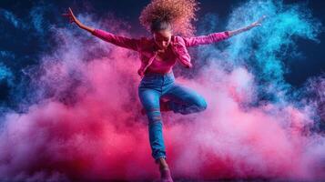 Dancer leaps, pink blue smoke, studio photo