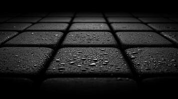 Wet black tiles, outdoor patio, dark background, texture photo