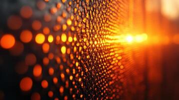 Sunset through metallic grid, bokeh background, abstract texture photo