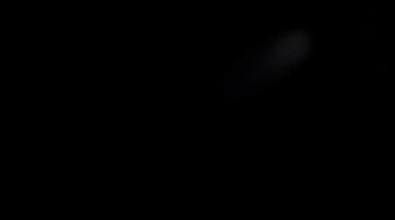 A dark abstract background with a subtle blurred light effect creating a mysterious mood photo