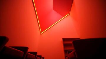 Abstract red illuminated room with geometric shapes and modern architectural design photo