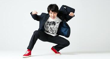 Energetic Japanese student in uniform jumping with enthusiasm and joy photo