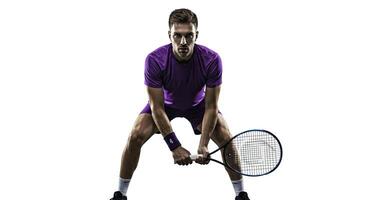 Focused tennis player ready to serve on white background action shot photo