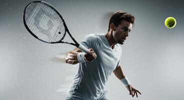 Intense male tennis player hitting forehand with racquet during match photo