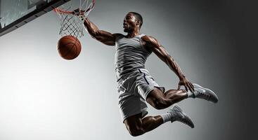 Powerful African American basketball player dunking with intense focus photo
