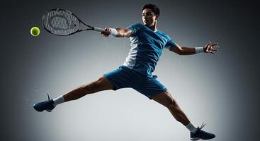 Professional male tennis player in dynamic action hitting ball with racket photo