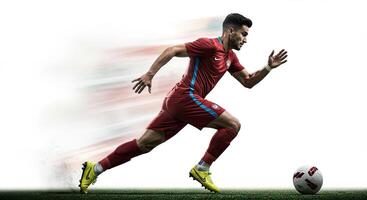Soccer player in action running towards the ball with speed effect on white background photo