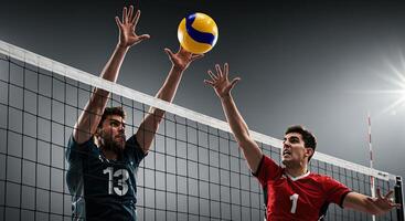 Two male volleyball players jumping to block the ball photo