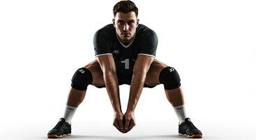 Volleyball player ready to receive the ball in defensive stance indoors photo