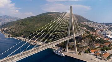 Aerial view of Franjo Tudman Bridge, a cable-stayed bridge, engineering work built for transportation and travel, near the port of Dubrovnik in Croatia photo