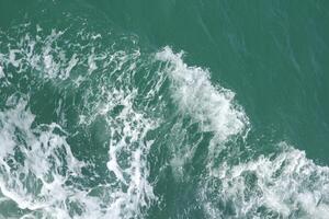 Sea background ocean and white foam from waves. photo
