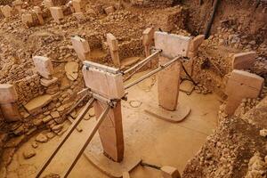 Ancient Stone Structures at Archaeological Site Capturing Early Human Civilization photo