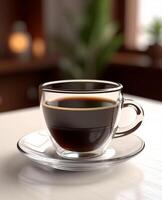 A cup of coffee on a table with a plant in the background photo