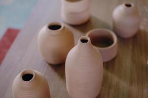 A table with several vases on it photo