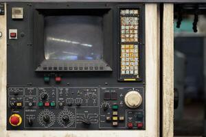 old lathe machine monitor control panel with button switch for metal CNC operating program photo