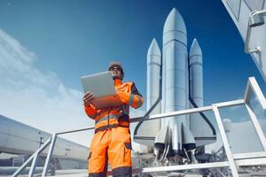 Professional engineer working in rocket lunch pad with laptop for control operate spaceship liftoff photo