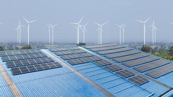 Modern factory using solar cell and wind turbine clean power source for saving energy and low carbon photo