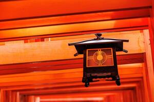 Red Tori walkway Fushimi Inari Shrine most famous travel place in Kyoto, Japan photo