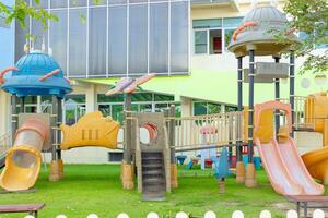 A playground with a slide and a slide for kids photo