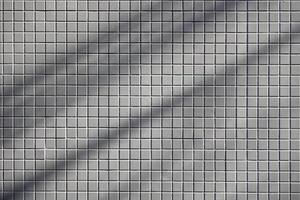 White square tiles sun shade and shadow texture pattern modern building japan style metro background photo