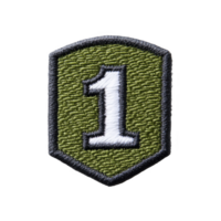 This is embroidered patch featuring large white number 1 on green background with black border. patch has shield like shape, often used for military or organizational insignia png