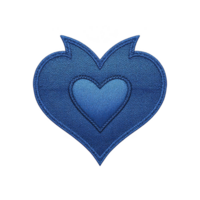 Blue heart shaped embroidered patch with layered design, featuring smaller heart in center, set against transparency background. patch has textured fabric appearance png
