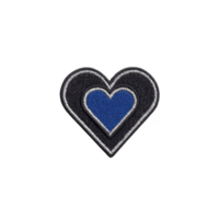 Heart shaped embroidered patch features blue center with black and gray border, creating striking contrast. patch is designed for clothing or accessories, adding touch of style png