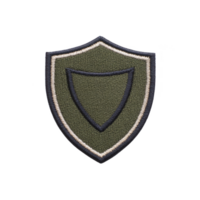 Green and beige embroidered shield patch with simple design, featuring double border. patch has textured fabric surface, suitable for clothing or accessories png