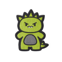 Cute, cartoon style green dinosaur with angry expression is depicted in this embroidered patch design. dinosaur features spiky back and gray belly, adding playful touch png