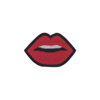 Red embroidered patch in shape of lips with black outline, showcasing playful and bold design. lips are slightly parted, revealing hint of white png