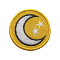 Round embroidered patch features white crescent moon and two stars on yellow background, symbolizing night and celestial themes. patch has yellow border, adding vibrant touch png
