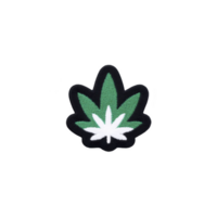 Green and white embroidered patch in shape of leaf, often associated with cannabis, is displayed on transparency background. design is simple and bold png