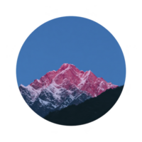 Stunning circular image of mountain range with snow capped peaks under clear blue sky, featuring unique pink hue on mountains png