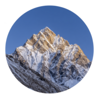 Majestic snow covered mountain peak stands tall against clear blue sky, illuminated by warm glow of sun. rugged terrain and sharp ridges create dramatic and awe inspiring landscape png