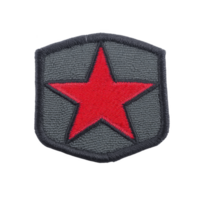 Gray embroidered patch features bold red star at its center, symbolizing strength and unity. patch is shield shaped, with dark border, often used in military or tactical gear png