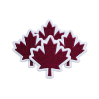Red maple leaf patches with white borders are arranged in cluster, symbolizing Canada. embroidered design is set against transparency background, highlighting vibrant colors png
