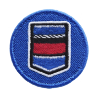 This shows round embroidered patch with blue background and central design featuring horizontal stripes in blue, red, and black, outlined in white. patch has textured appearance png