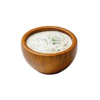 Wooden bowl filled with creamy ranch dressing garnished with fresh dill, creating delicious and inviting appearance. smooth texture and herbs add touch of freshness png