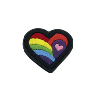 A colorful embroidered heart patch features rainbow design with smaller pink heart inside, symbolizing love and inclusivity. vibrant colors create joyful and expressive look png