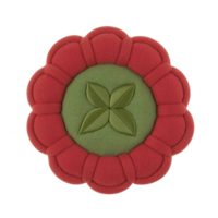 A round, decorative cushion with red petal like border and green center featuring leaf pattern, creating floral design. cushion is plush and textured, ideal for home decor png