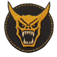 A fierce embroidered patch features yellow horned monster with sharp teeth on dark circular background, outlined with yellow stitching. design is bold and striking png